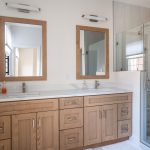 Kitchen area with built-in cabinetry, wine fridge, and open shelving