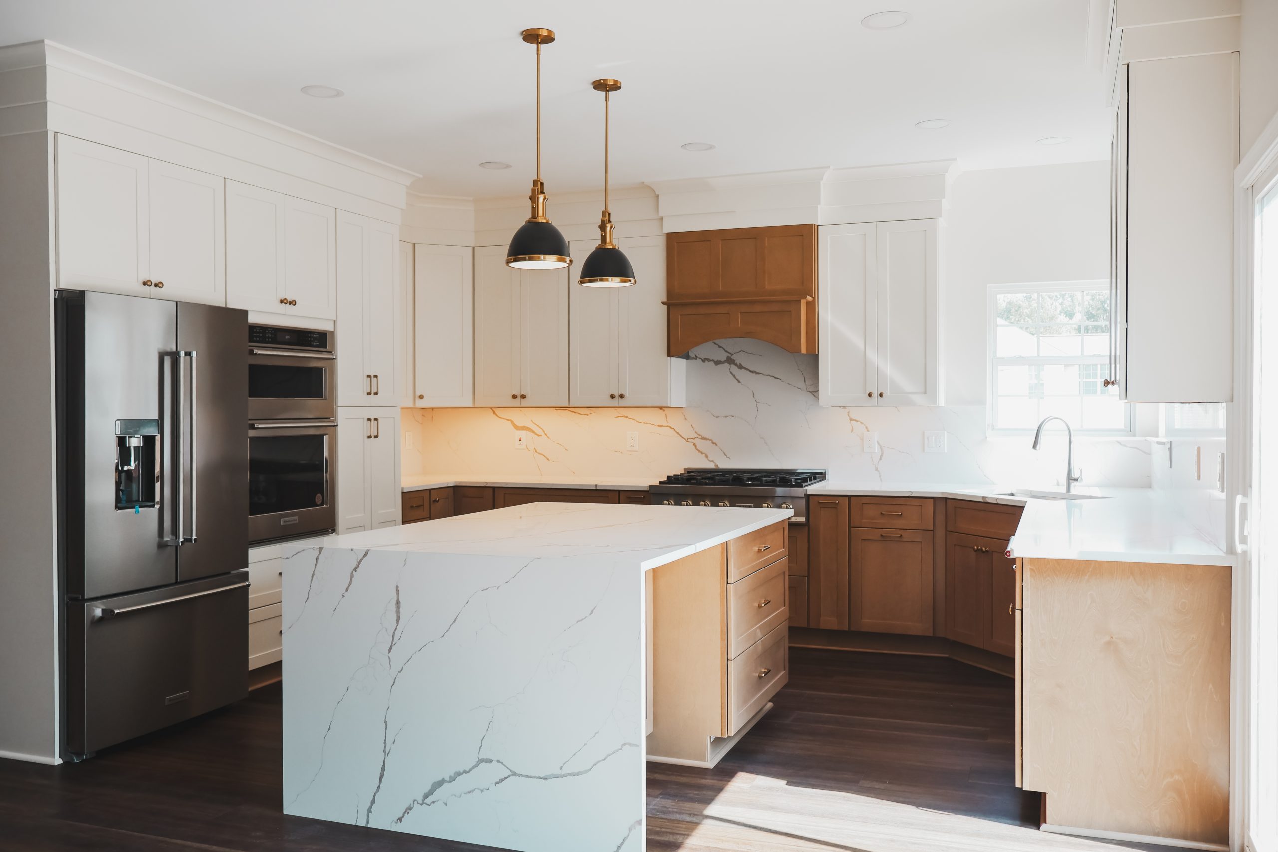 great falls kitchen remodel with quartz island white cabinets and wood base cabinets