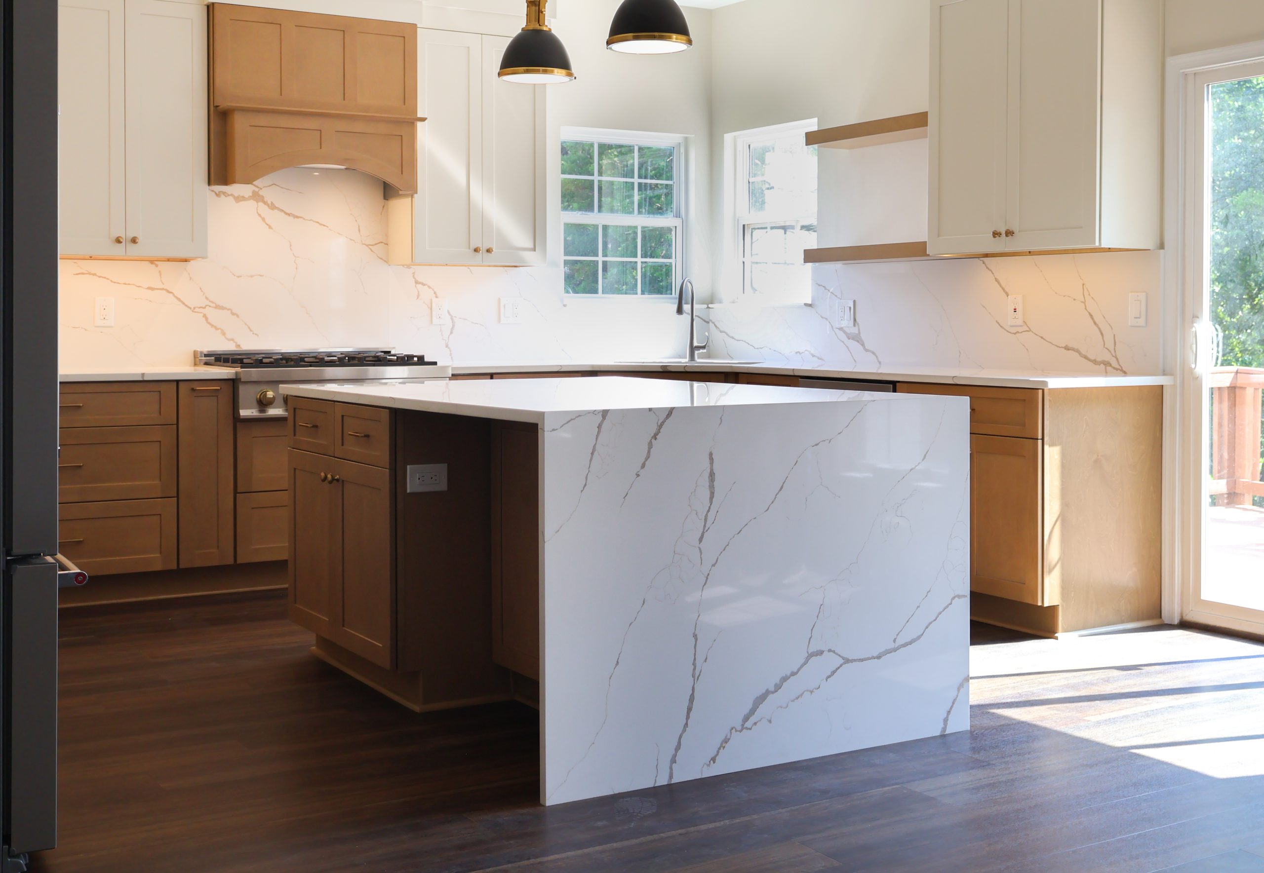 Washington DC kitchen remodel with hardwood flooring wood cabinets quartz island and natural light