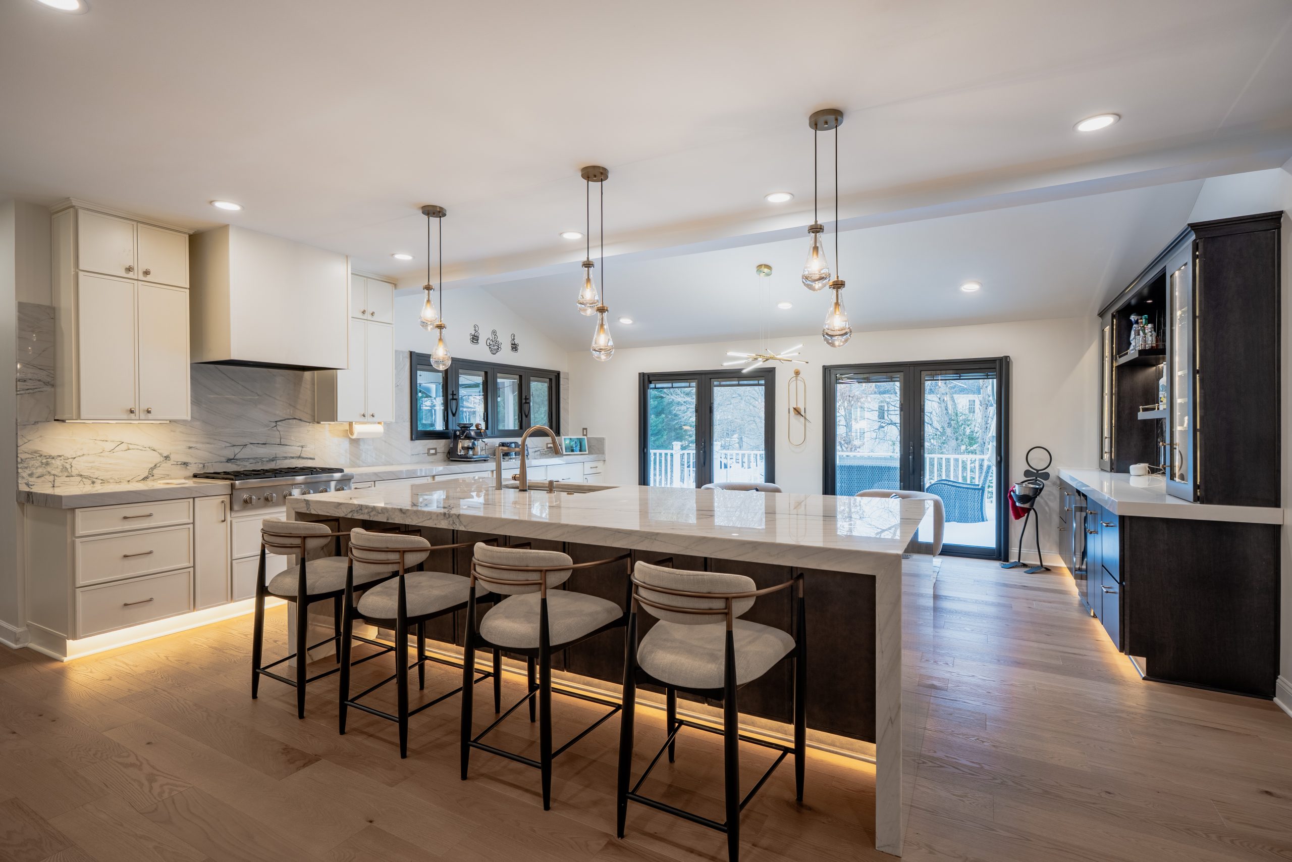 Chantilly VA kitchen remodel with open layout, white cabinets, dark wood island, LED under-cabinet and toe-kick lighting
