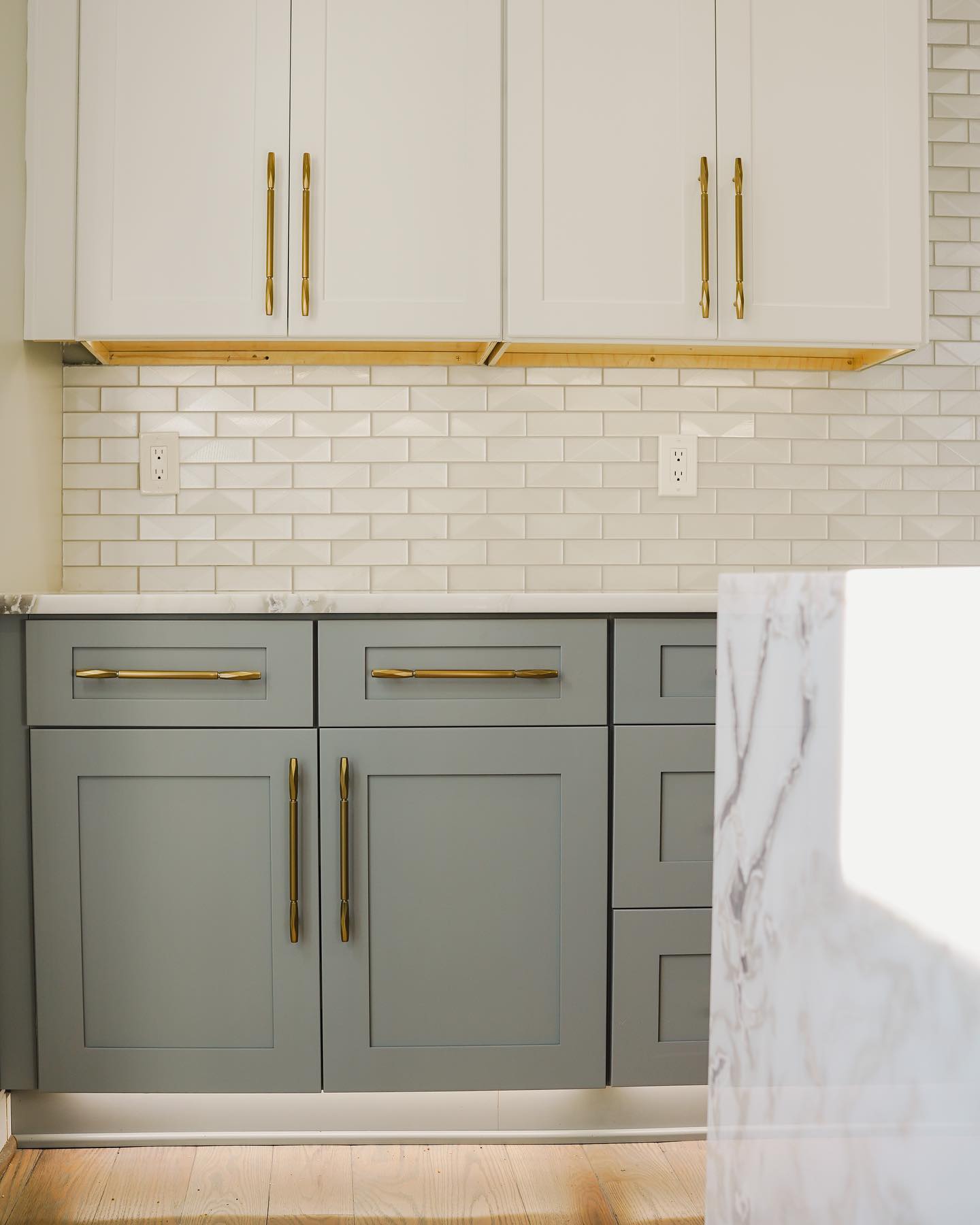 kitchen with pistachio green cabinets and white subway tile backsplash