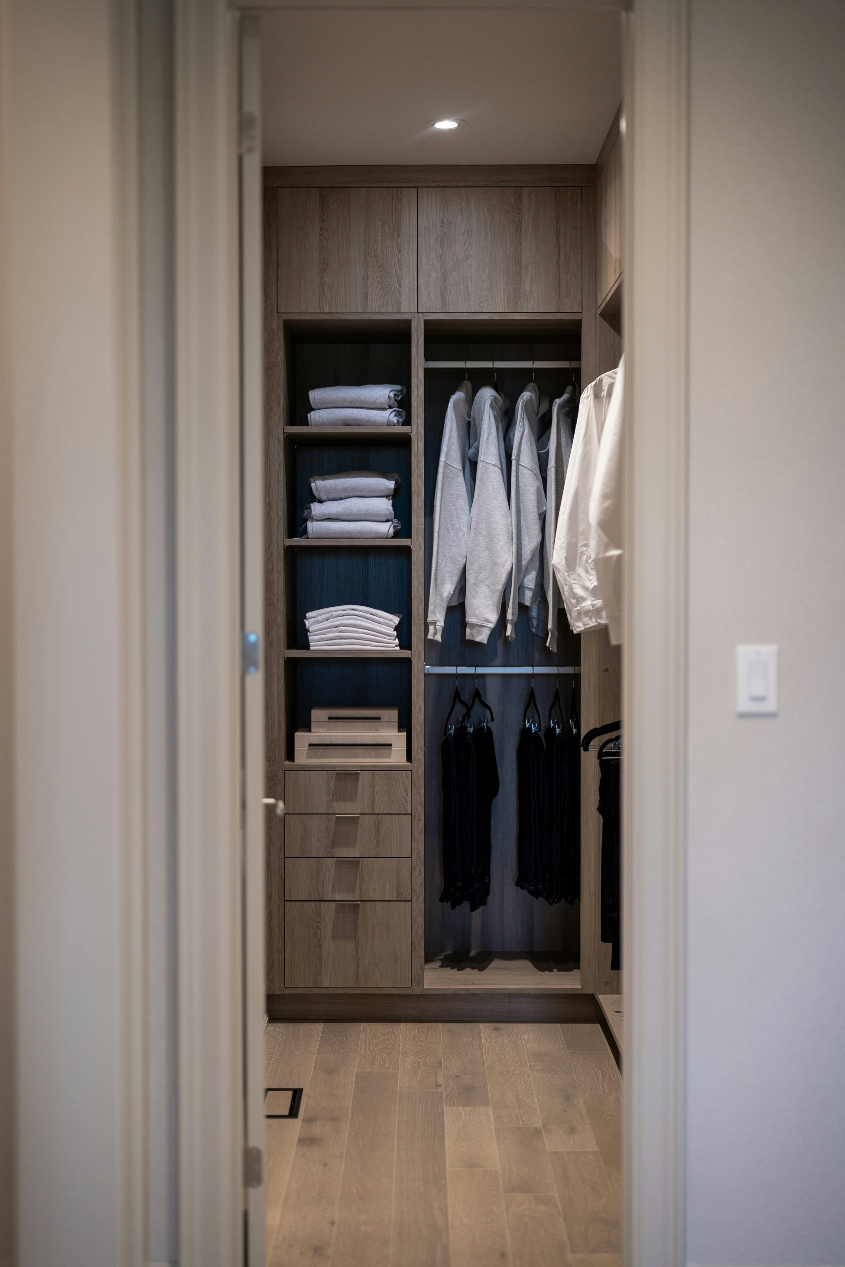 small walk-in closet size with drawers, shelves, and hanging space