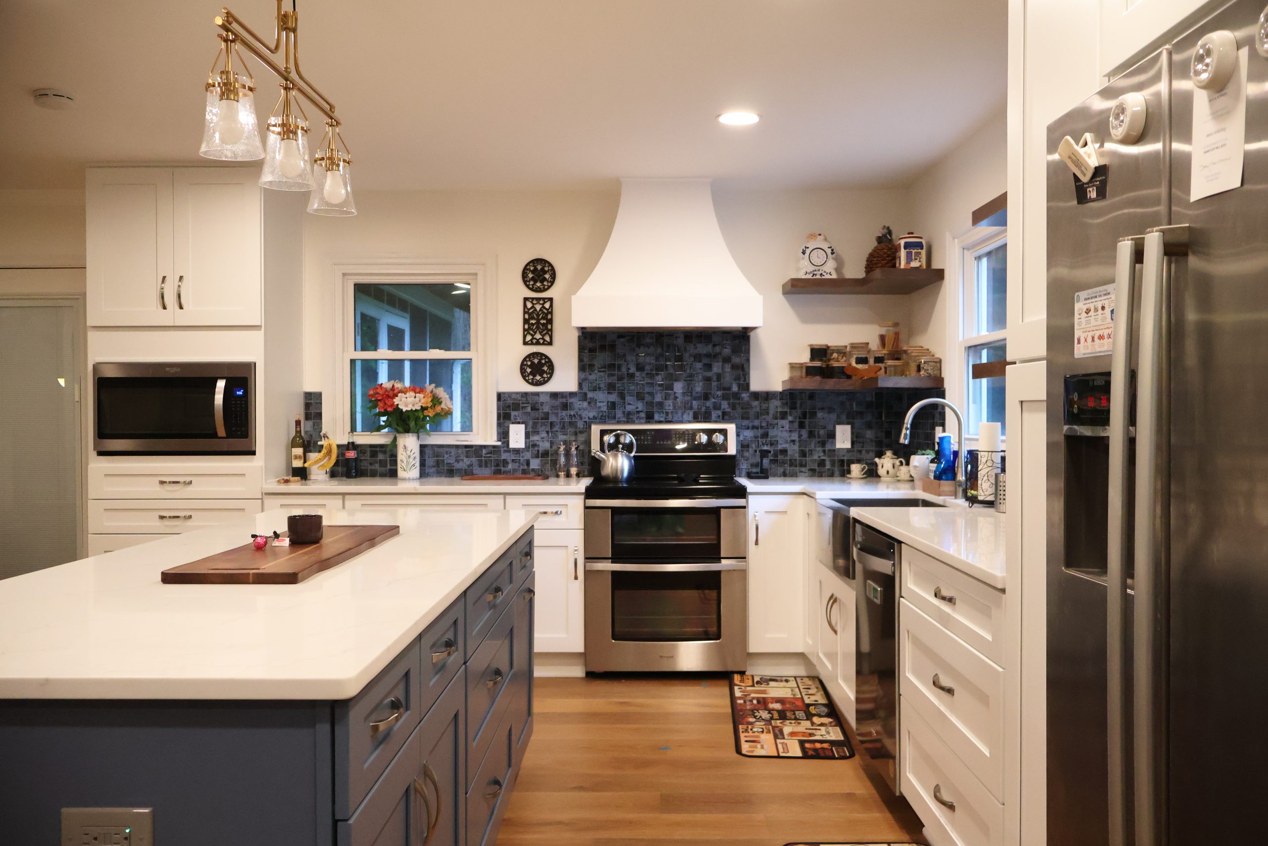 navy and white kitchen cabinets with a classic design