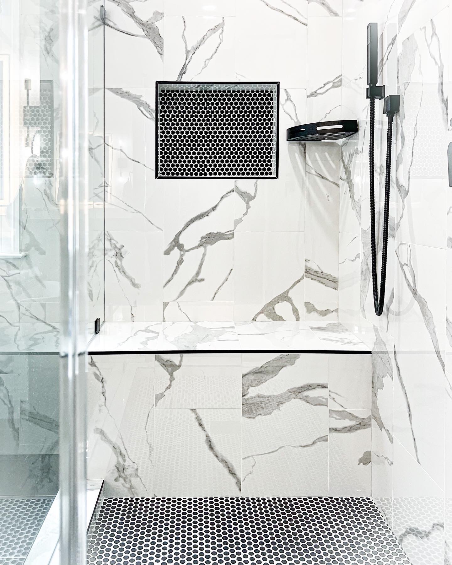 Large-format porcelain tile used on the walls of a modern shower