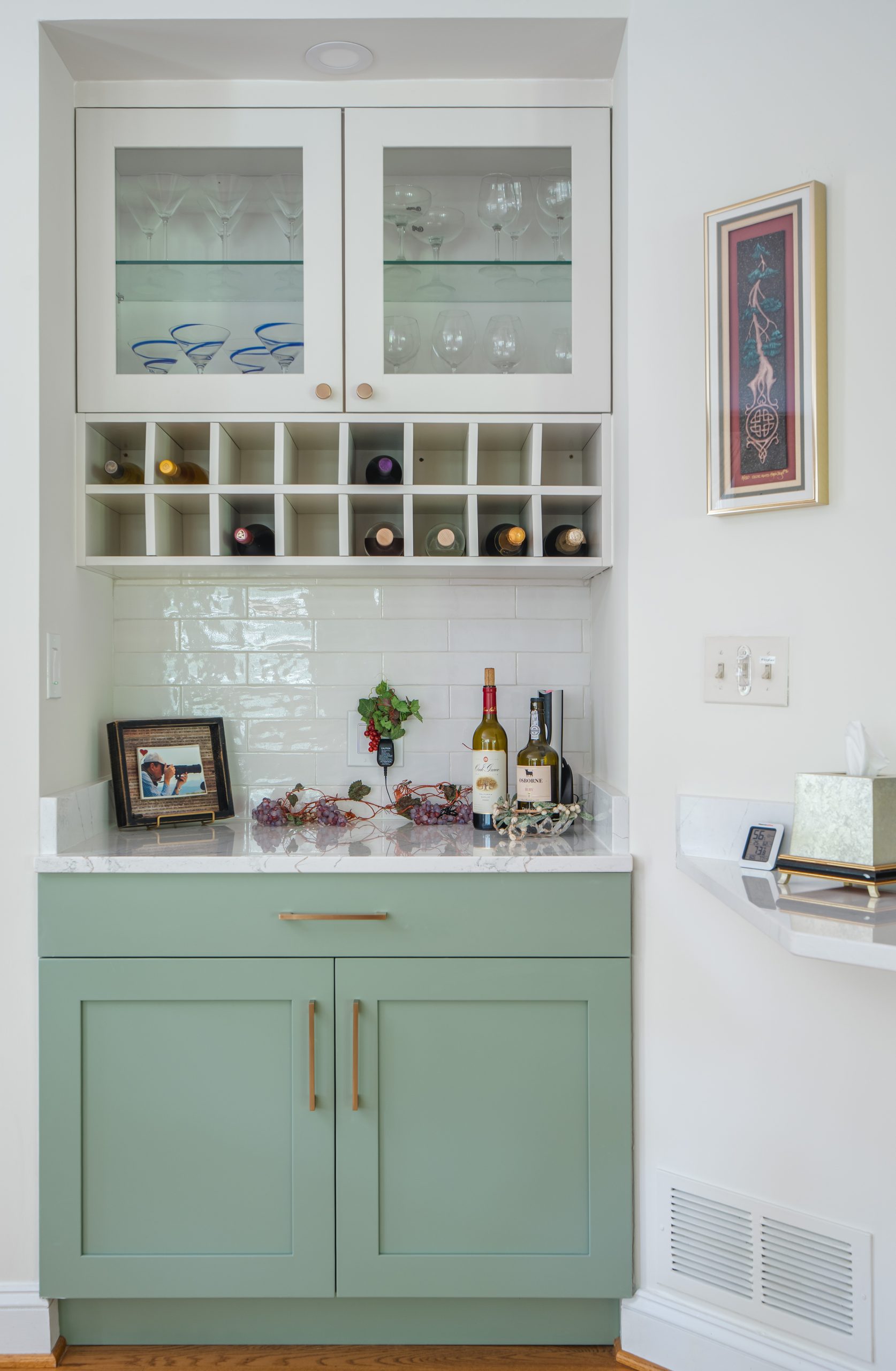 Built-in kitchen beverage station with cabinetry, countertop, shelving