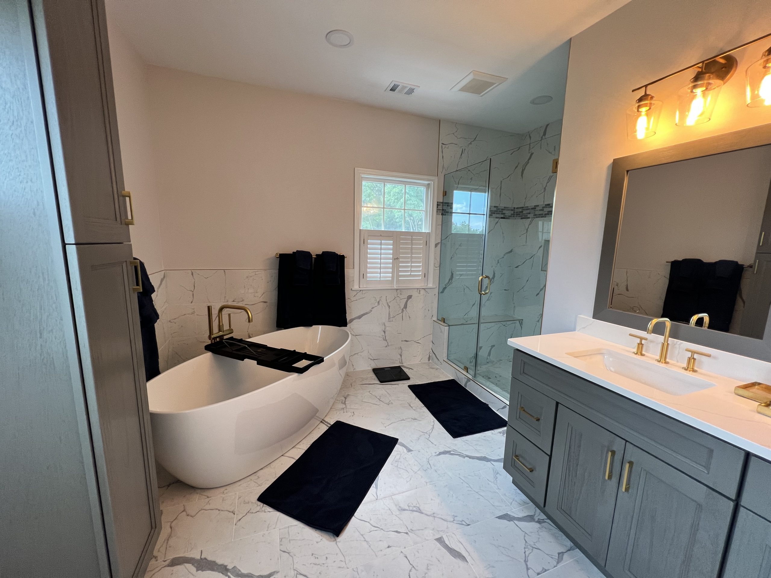 Contemporary bathroom remodel with walk-in shower and modern vanity