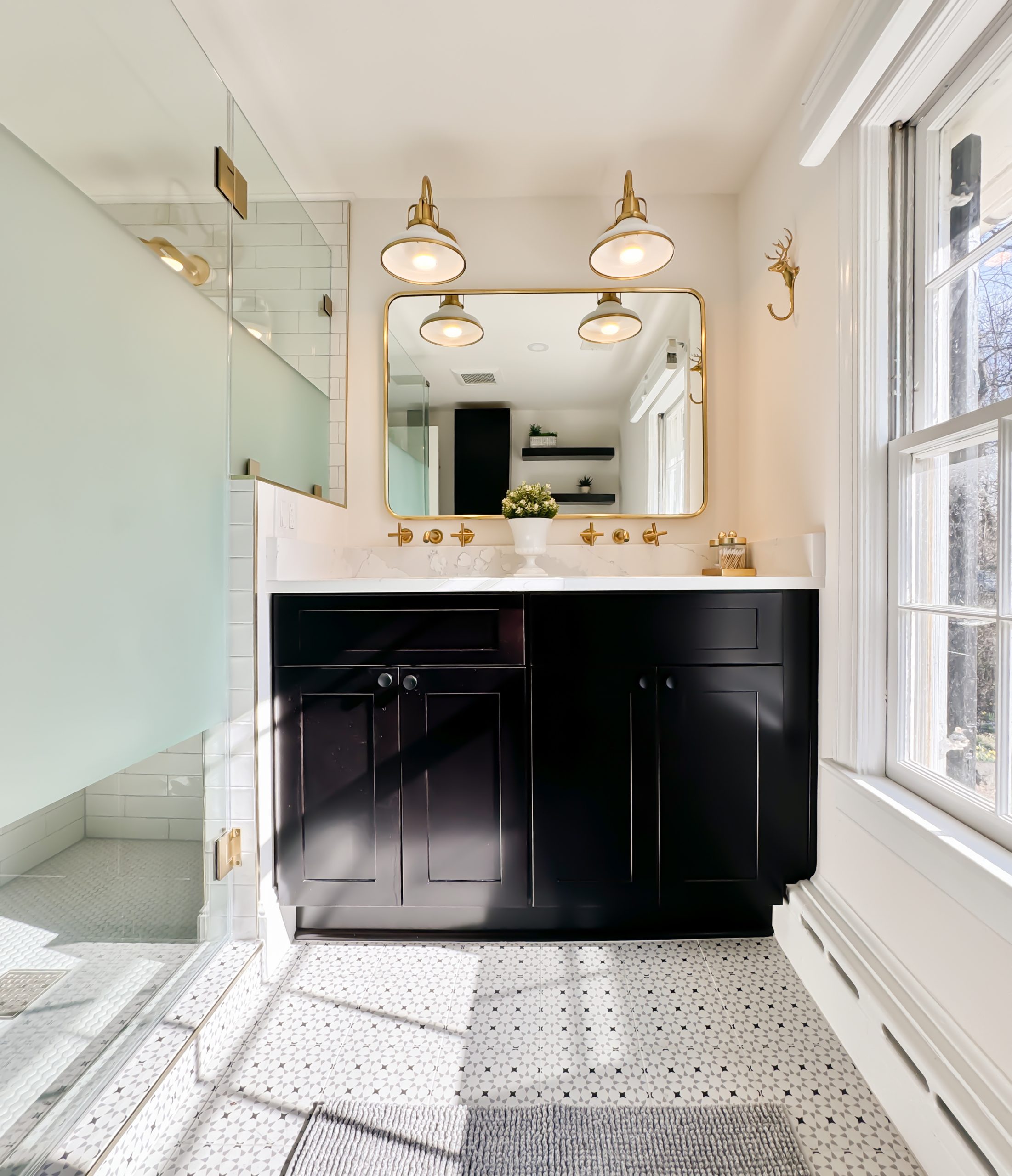 Small bathroom remodel with white cabinetry, open shelving, and modern finishes