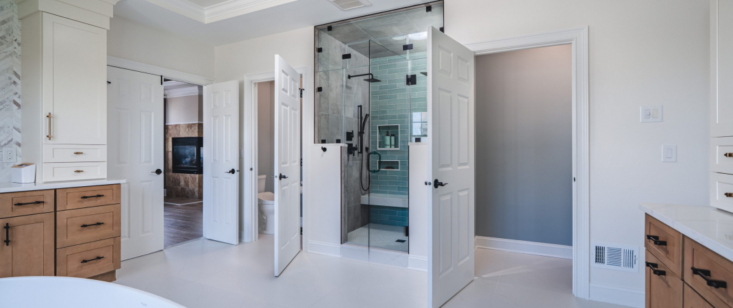 Modern white bathroom with clean lines and spacious layout.