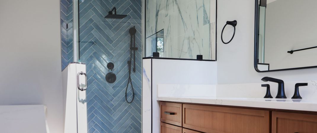 Modern bathroom remodel in Purcellville, VA with a frameless glass shower wall and neutral tones.