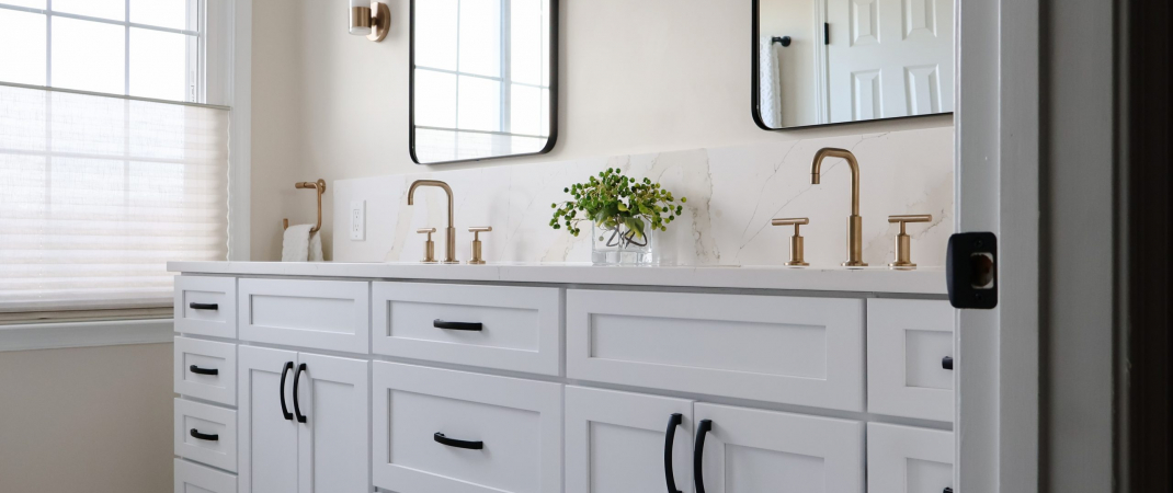 Remodeled white bathroom in Leesburg, VA featuring clean design and modern fixtures.