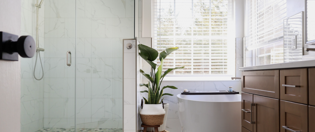 Small bathroom remodel in Aldie with brown cabinets and white walls